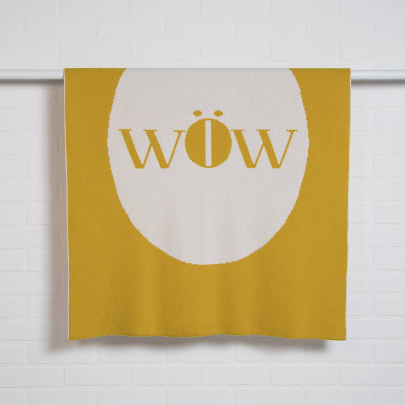 tullibee knitted blanket WOW mustard hanging