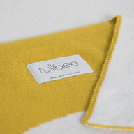 tullibee knitted blanket WOW mustard brand label close up